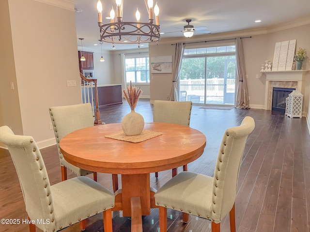 dining room featuring ornamental molding, dark hardwood / wood-style floors, and a chandelier