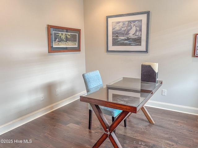 dining area featuring dark hardwood / wood-style flooring