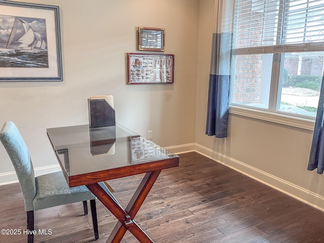 office area with dark hardwood / wood-style flooring and a healthy amount of sunlight