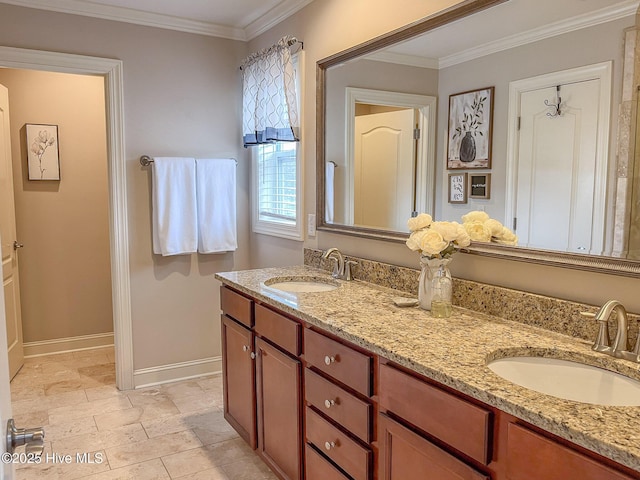 bathroom with vanity and ornamental molding