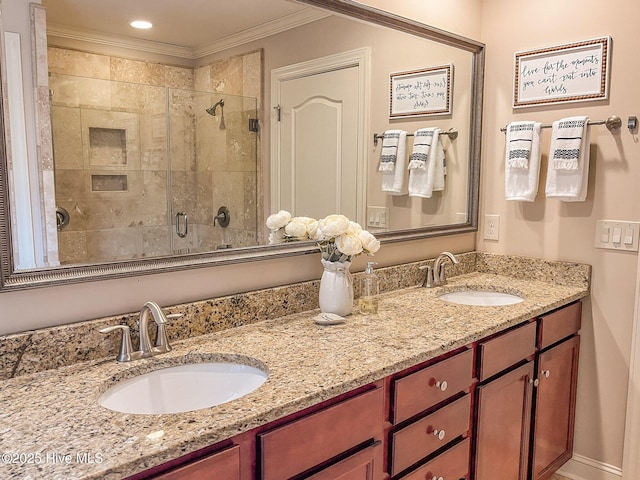 bathroom with crown molding, an enclosed shower, and vanity