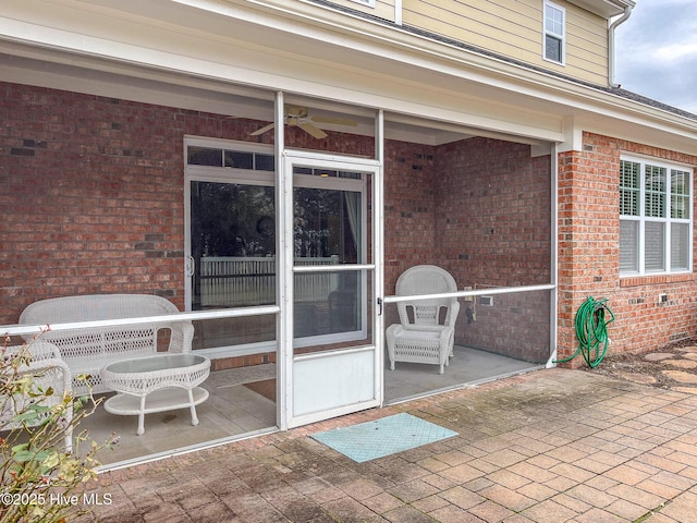 view of patio featuring ceiling fan