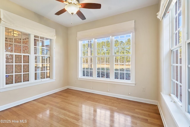 unfurnished room featuring ceiling fan and light hardwood / wood-style flooring