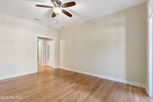 empty room featuring ceiling fan and light hardwood / wood-style flooring