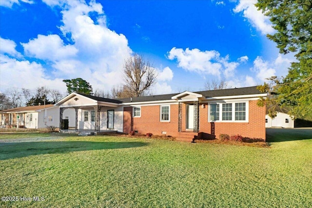 single story home featuring a front yard