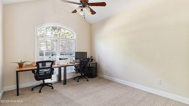 carpeted home office with ceiling fan and lofted ceiling