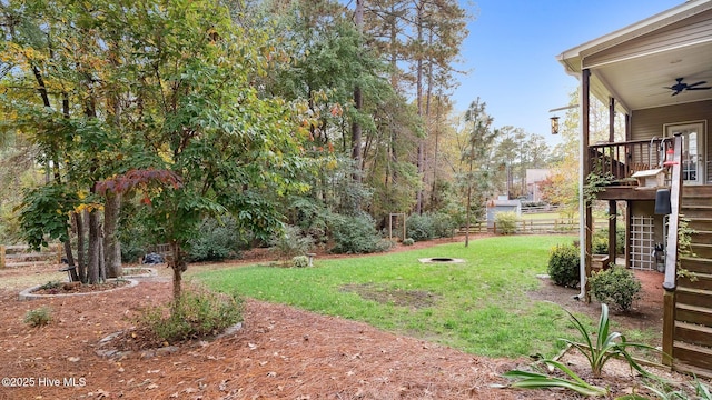 view of yard with ceiling fan