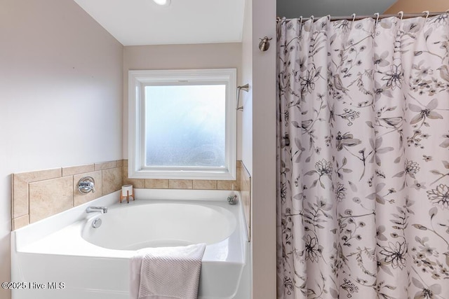 bathroom with shower with separate bathtub