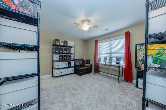 sitting room featuring ceiling fan and light colored carpet