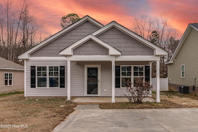 view of front of property with covered porch and cooling unit