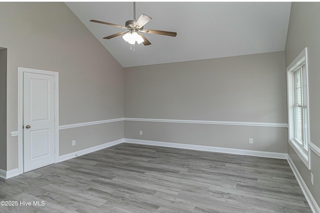 unfurnished room featuring ceiling fan, light hardwood / wood-style flooring, and high vaulted ceiling