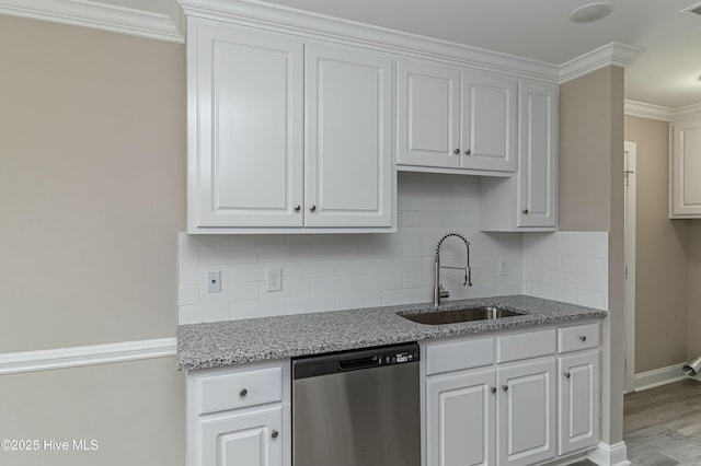 kitchen with white cabinets, dishwasher, and sink