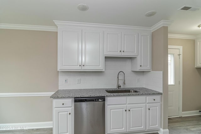 kitchen featuring dishwasher, white cabinets, light hardwood / wood-style floors, and sink