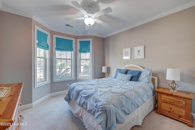 carpeted bedroom featuring crown molding and ceiling fan