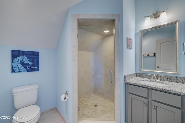 bathroom with an enclosed shower, vanity, vaulted ceiling, tile patterned floors, and toilet