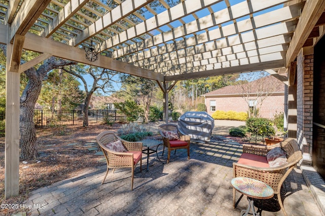 view of patio with a grill and a pergola