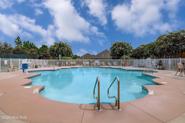 view of pool featuring a patio area