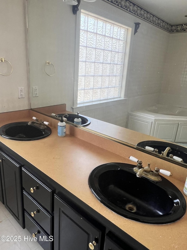 bathroom with tile patterned floors and vanity