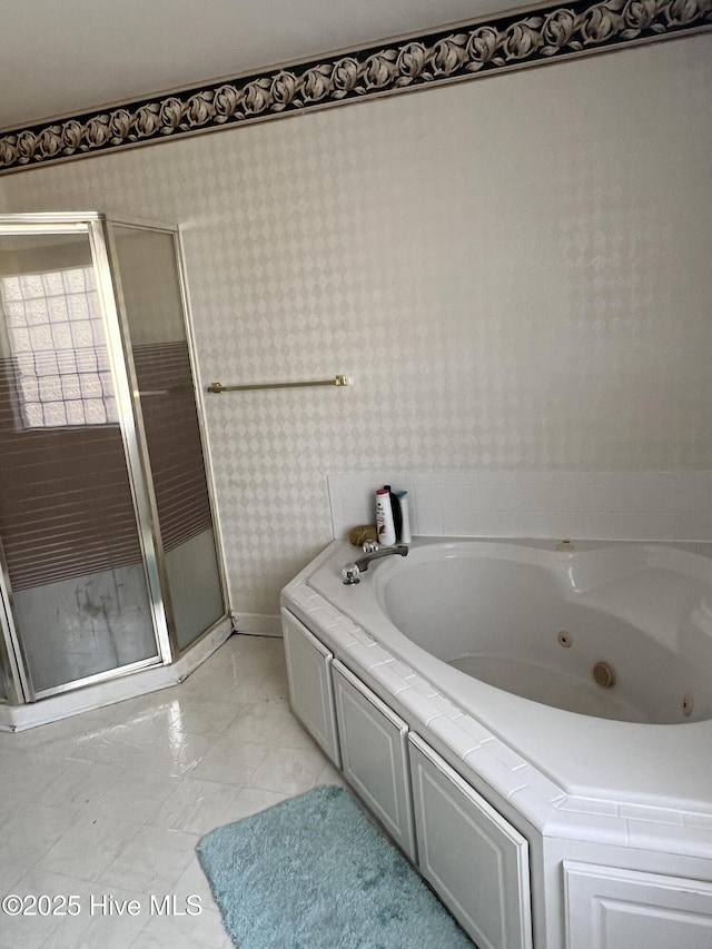 bathroom featuring separate shower and tub