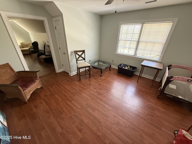 sitting room featuring a ceiling fan, visible vents, wood finished floors, and baseboards