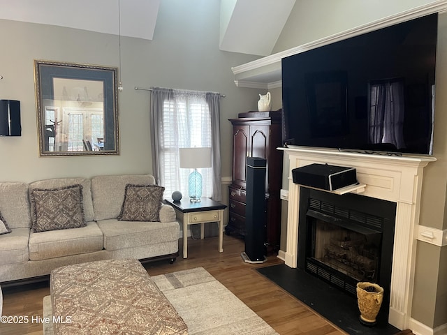 living room featuring hardwood / wood-style floors and vaulted ceiling