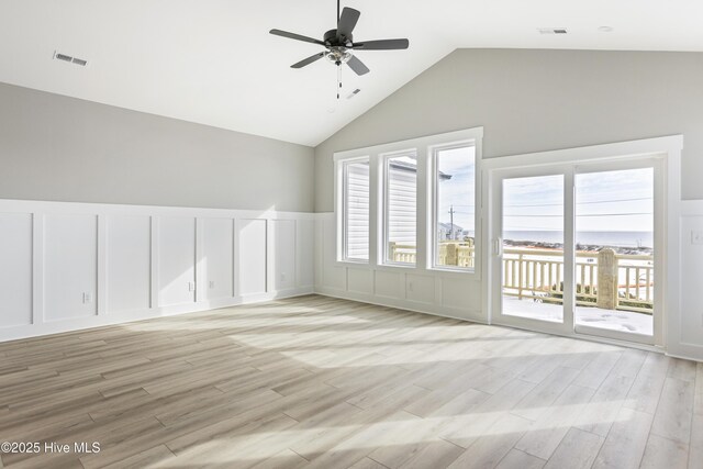 empty room with light wood-type flooring and ceiling fan