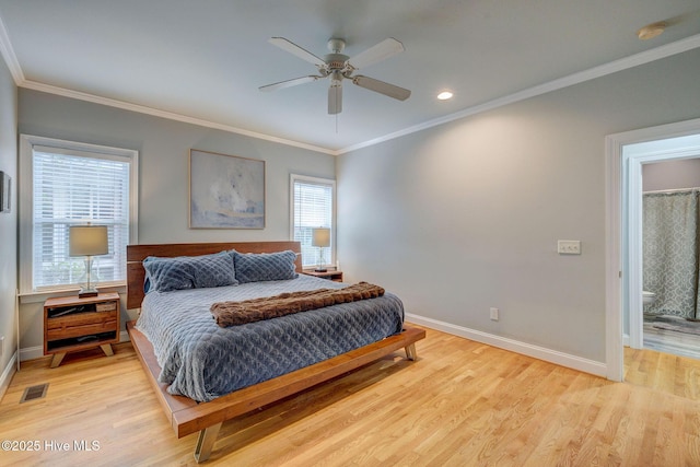 bedroom with multiple windows, ceiling fan, light wood-type flooring, and ornamental molding