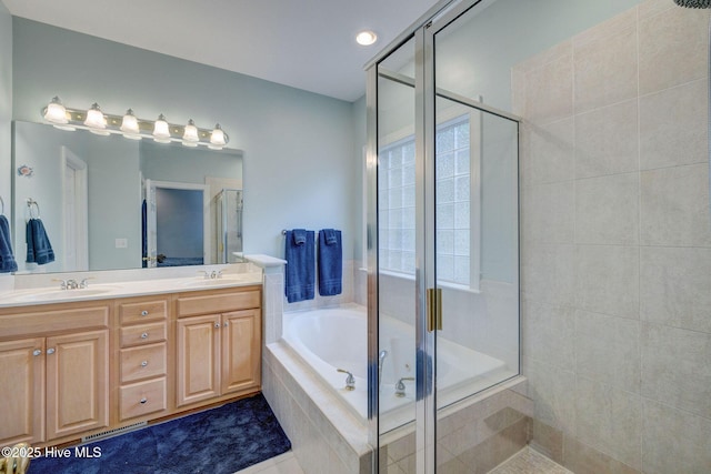 bathroom with tile patterned floors, vanity, and independent shower and bath