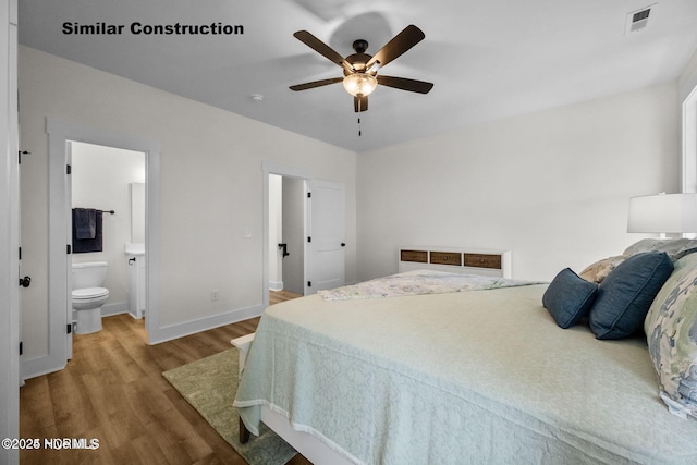 bedroom with connected bathroom, ceiling fan, and hardwood / wood-style flooring