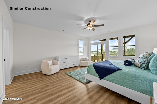 bedroom featuring hardwood / wood-style floors and ceiling fan