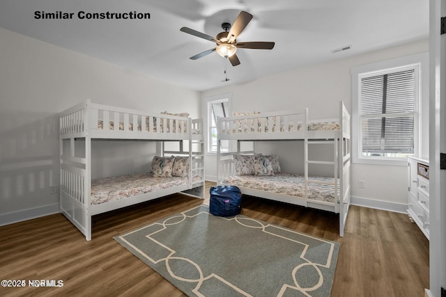 bedroom featuring ceiling fan and dark hardwood / wood-style flooring