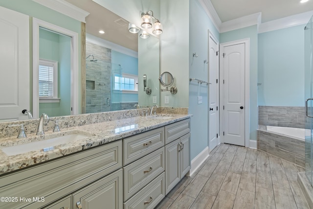 bathroom featuring vanity, a healthy amount of sunlight, ornamental molding, and shower with separate bathtub