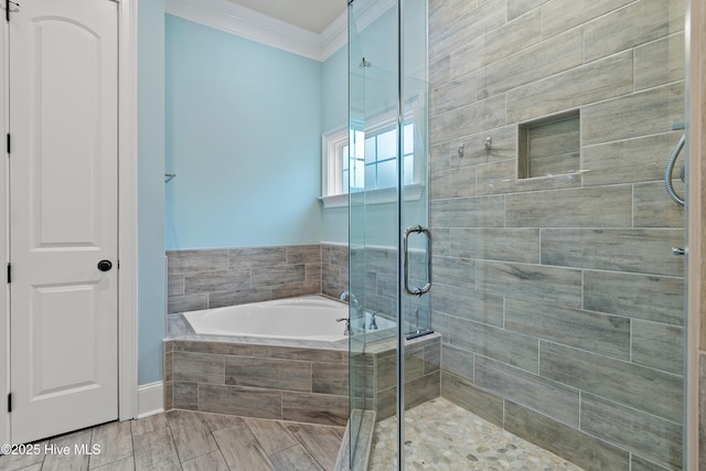 bathroom with crown molding and independent shower and bath