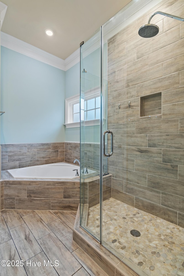 bathroom with plus walk in shower and ornamental molding