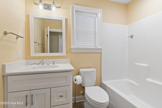 full bathroom with vanity, shower / bathtub combination, and toilet