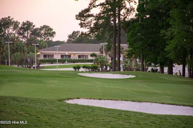 view of home's community featuring a lawn