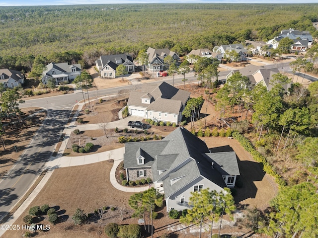 aerial view with a residential view and a view of trees