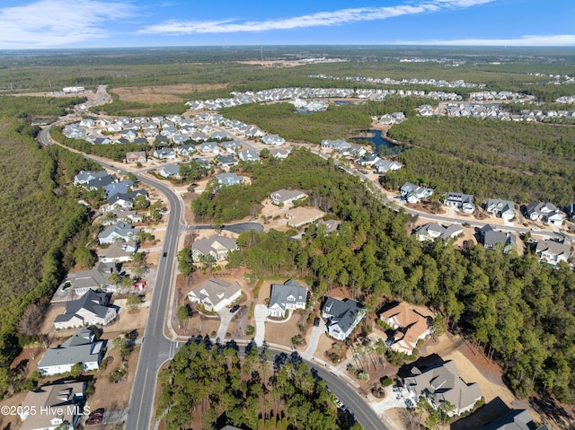 birds eye view of property with a residential view