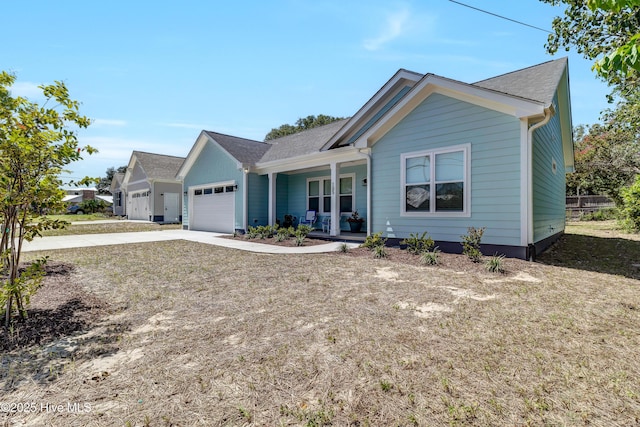 view of front of house featuring covered porch and a garage