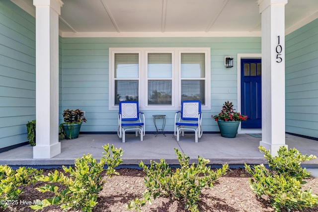 doorway to property with a porch