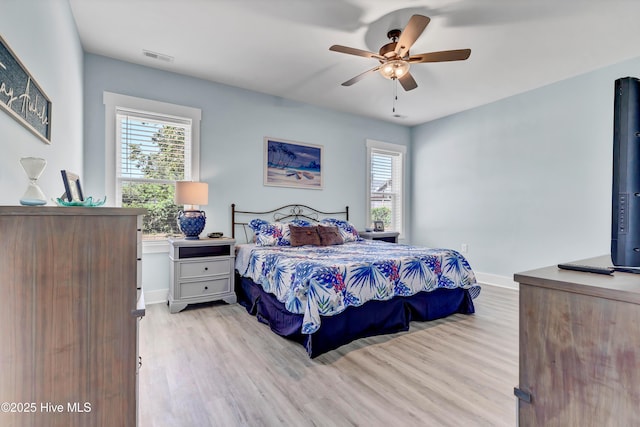 bedroom with ceiling fan and light hardwood / wood-style flooring