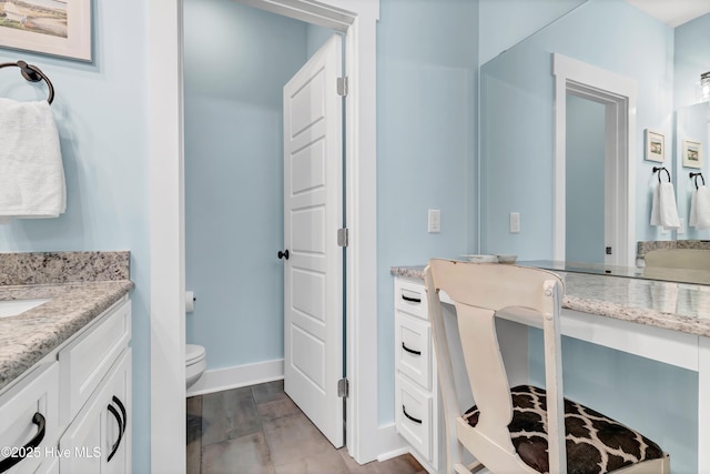 bathroom with vanity and toilet