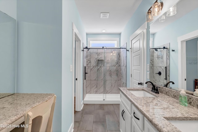 bathroom with vanity and an enclosed shower