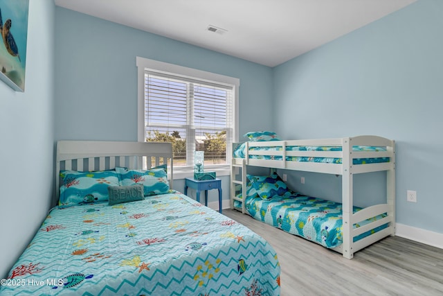 bedroom with hardwood / wood-style floors