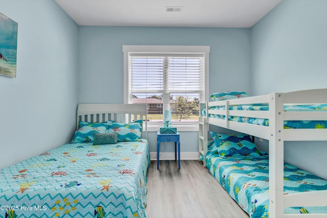 bedroom with wood-type flooring