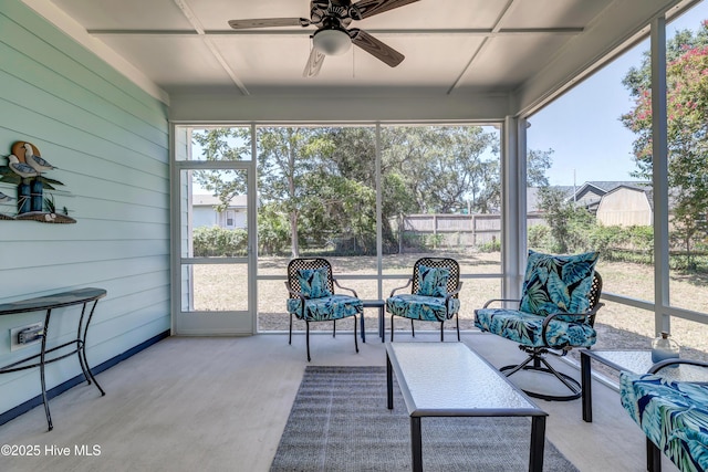 sunroom / solarium with ceiling fan and plenty of natural light