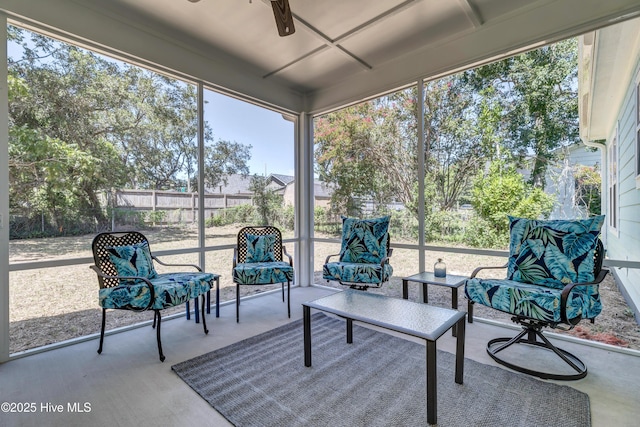 sunroom / solarium featuring a wealth of natural light and ceiling fan