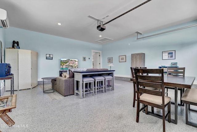 dining space featuring an AC wall unit