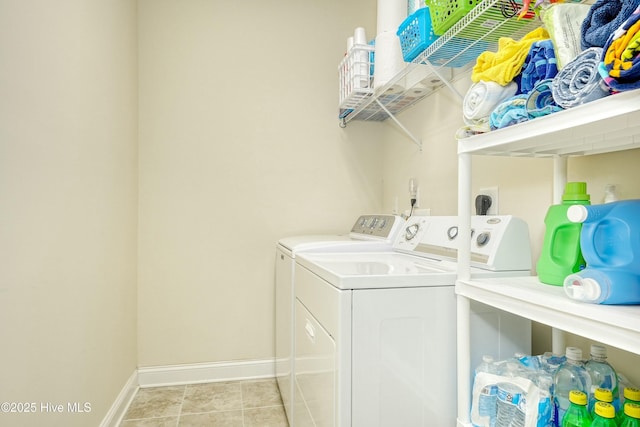 clothes washing area featuring washing machine and clothes dryer