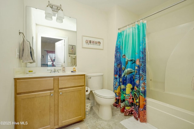 full bathroom featuring shower / bath combo with shower curtain, vanity, and toilet